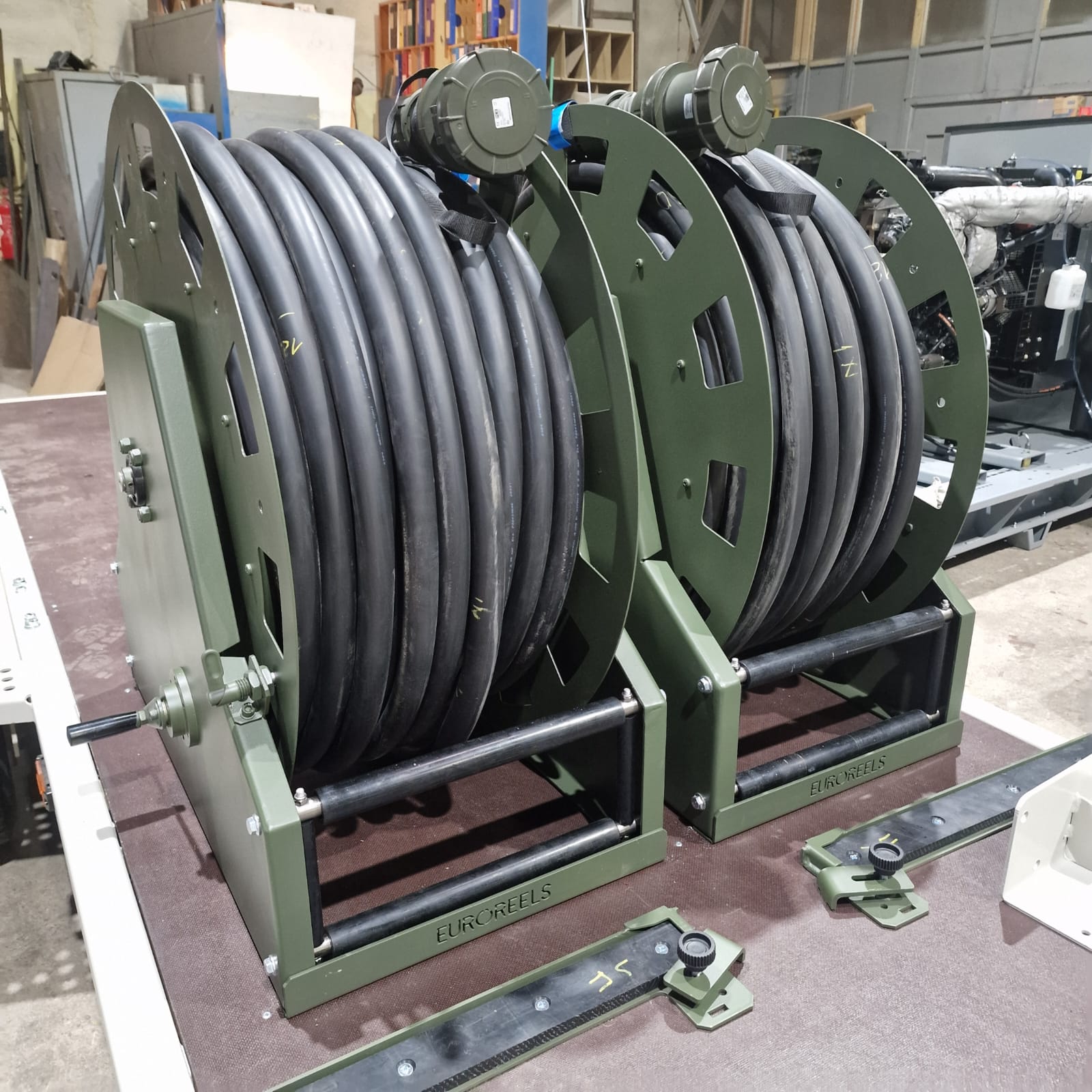 Heavy-duty cable reels mounted near mobile generator equipment for field deployment